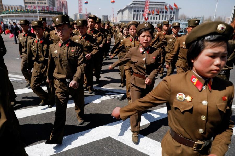 North Korean soldiers march as they visit the newly constructed residential complex after its opening ceremony in Ryomyong street. North Korea,Pyongyang,Postcards from Pyongyang,Kim Il-sung,father Kim Il-sung