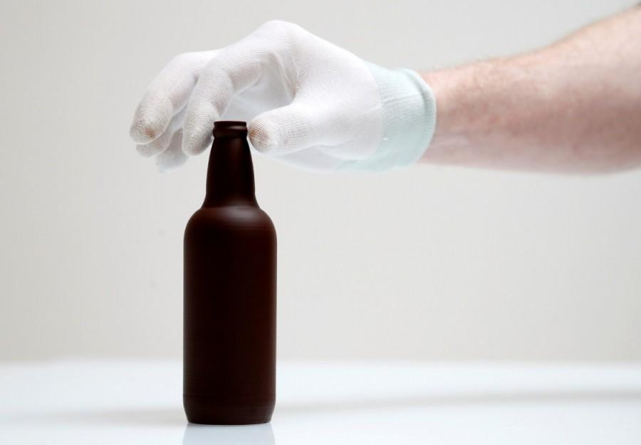 Gaetan Richard, founder of the Miam Factory 3D printing chocolate company, displays a chocolate beer bottle after being printed at Belgian chocolate company Miam Factory in Gembloux, Belgium, April 10, 2017. Chocolate printed in 3D,Chocolate 3D,printed in 3D,Beer bottles,Belgian chocolate company,Miam Factory