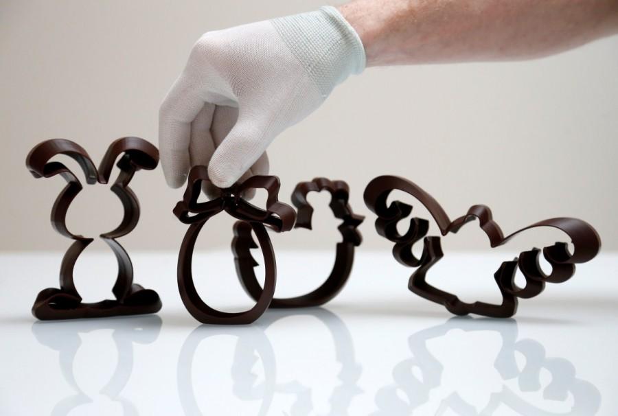 Gaetan Richard, founder of the Miam Factory 3D printing chocolate company, displays three-dimensional Easter-themed shapes after being printed at Belgian chocolate company Miam Factory in Gembloux. Chocolate printed in 3D,Chocolate 3D,printed in 3D,Beer bottles,Belgian chocolate company,Miam Factory