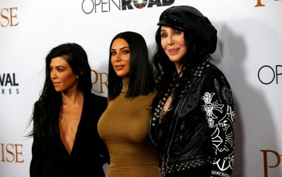 Singer Cher (R) poses with television personalities Kim Kardashian (C) and Kourtney Kardashian at the premiere of 