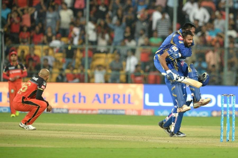 For Mumbai, McClenaghan scalped two wickets for 20 runs in four overs while Hardik Pandya and Krunal Pandya chipped in with one wicket each. Kohli, who was injured during the third Test match against Australia, made his comeback in style with a 62-run knock, which comprised of five fours and two sixes. The 28-year-old came out to bat with Gayle (22) and forged a 63-run partnership in 10 overs to give the RCB a perfect start. But when the duo started shifting gears, Gayle, who blasted one six and two boundaries, fell to medium-pacer Hardik Pandya. A head-height short bowl did the trick for Mumbai as Gayle was caught by wicketkeeper Parthiv when he tried to pull the ball. De Villiers (19) and Kohli then continued to punish the bowlers with some great show around the park. In the process, Kohli reached his fifty with a huge six. But soon, Kohli was dismissed by pacer Mitchell McClenaghan. The skipper had added 47 runs for the second wicket with de Villiers. Samuel Badree,Samuel Badree RCB,Samuel Badree hattrick,Kieron Pollard,Mumbai Indians stun Royal Challengers Bangalore,Mumbai Indians beats Royal Challengers Bangalore,Mumbai Indians,Royal Challengers Bangalore,RCB,MI,RCB vs MI,MI vs RCB