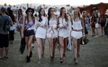 Victoria's Secret model Alessandra Ambrosio of Brazil (C) walks through the Coachella Valley Music and Arts Festival with friends, in Indio, California April 12, 2015.