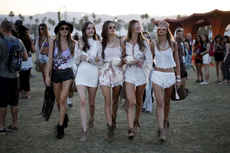 Victoria's Secret model Alessandra Ambrosio of Brazil (C) walks through the Coachella Valley Music and Arts Festival with friends, in Indio, California April 12, 2015. Coachella 2017,Coachella,Coachella festival,Coachella festival 2017,The Music and Arts Festival,Coachella 2017 pics,Coachella 2017 images,Coachella 2017 stills,Coachella 2017 pictures,Coachella 2017 phoots