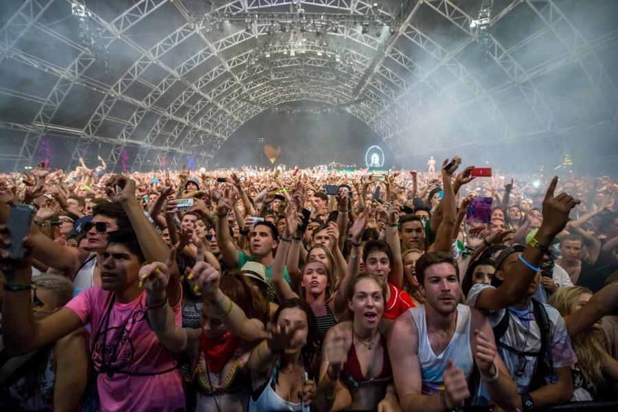 Fans listen to David Guetta at the Coachella Valley Music and Arts Festival in Indio, California April 12, 2015. Coachella 2017,Coachella,Coachella festival,Coachella festival 2017,The Music and Arts Festival,Coachella 2017 pics,Coachella 2017 images,Coachella 2017 stills,Coachella 2017 pictures,Coachella 2017 phoots