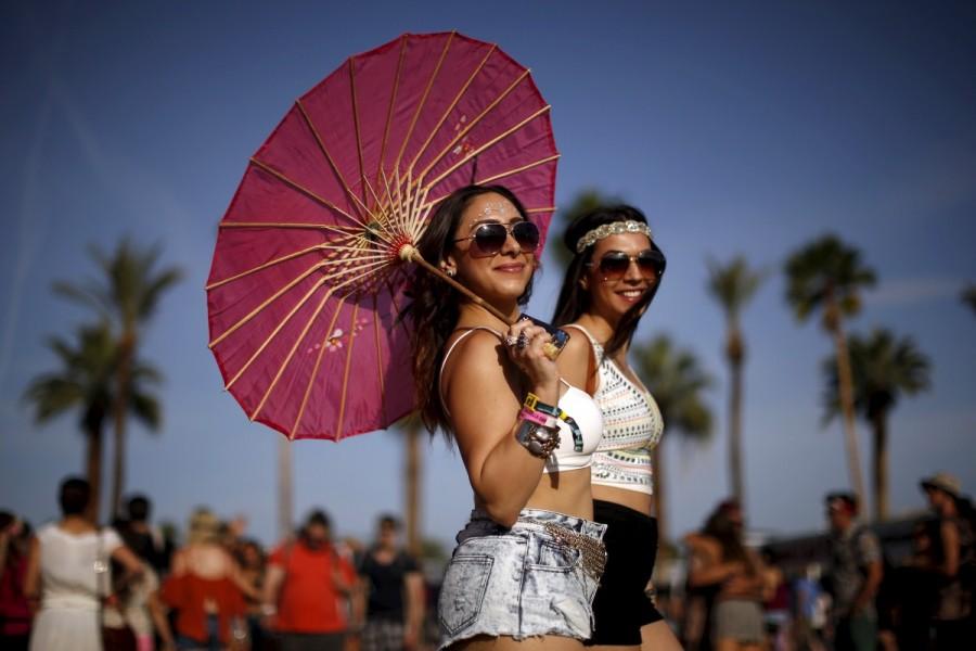 Lemeese Ghosal (L) and Reem Mansoor walk through the Coachella Valley Music and Arts Festival in Indio, California April 10, 2015. Coachella 2017,Coachella,Coachella festival,Coachella festival 2017,The Music and Arts Festival,Coachella 2017 pics,Coachella 2017 images,Coachella 2017 stills,Coachella 2017 pictures,Coachella 2017 phoots
