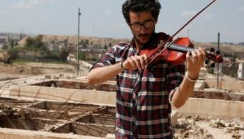 Iraqi violinist,violinist,Mosul after ISIS,Iraqi violinist returns to play Mosul,Muslims and Christians in Mosul,Ameen Mukdad,Islamic State militants,Islamic State