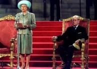 Queen Elizabeth II delivers an address to both houses of parliament at the Palace of Westminster May 5 watched by Prince Philip (R).