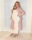 Pregnant Beyonce shows off her growing baby bump.