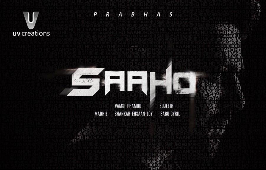 After playing the title role in Baahubali, Prabhas's next is an ambitious hi-tech action drama titled SAAHO. One of India’s best epic fantasy films – Baahubali’s star performer Prabhas is all set to win hearts again with his next trilingual movie called ‘Saaho’. Saaho's teaser is even going to be attached with Baahubali 2. Just as the expectations of Baahubali 2 are rising, fans of Prabhas across India have been speculating and anticipating Prabhas' next film. Prabhas has become a household name after his portrayal of the title role in Baahubali. Fans, followers, critics and the industry are waiting breathlessly to see Prabhas on the big screen again. The actor undertook immense prep to get into the skin of his character in Baahubali, and Baahubali 2 promises to be just as exhilarating. In Saaho, however, it will be a different Prabhas in a different role, a very different setting, put together with a very different recipe: think very fast-paced and high-tech action on a huge scale, with a healthy dose of romance with handfuls of thrills and pinches of drama. Saaho will be a new, exciting and saucy mix, but put together very tastefully and served with style. Saaho,Saaho first look poster,Saaho first look,Saaho poster,Saaho movie poster,Prabhas,Baahubali 2
