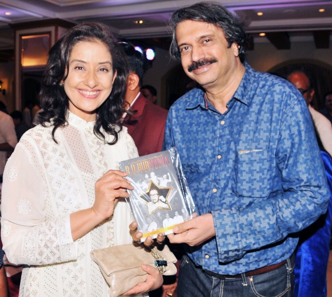The charismatic Manisha Koirala, who was Anil Kapoor's love and obsession in the memorable song 'Ek Ladki Ko Dekha Toh Aisa Laga' from the illustrious R.D.Burman's last movie 1942: A Love Story, seemed nostalgic about the composer this week. Manisha was delighted when at a recent event, senior award-winning journalist Chaitanya Padukone presented her a copy of his authored book RD BurMania. “What a musical masterpiece genius Panchamda came up with. Even today, his amazing melodies soothe the heart," said Manisha, who is playing the legendary Nargis Dutt in the biopic on Sanjay Dutt, being directed by Rajkumar Hirani. The actress who has proved to be an exemplary strong-willed cancer survivor, had another reason to smile. The book has its 'foreword' penned by showman Sanjay Leela Bhansali, who was then the 'songs director' of 1942: A Love Story. Manisha Koirala,R.D Burman,Anil Kapoor,Ek Ladki Ko Dekha Toh Aisa Laga,Burman,Chaitanya Padukone