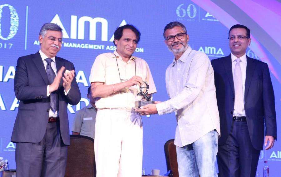 Filmmaker and Screenwriter Nitesh Tiwari receives Director of the Year award from Union Railway Minister Suresh Prabhu at the AIMA Awards ceremony in New Delhi, on April 27, 2017. Nitesh Tiwari,AIMA Awards,Director of the Year award,Director of the Year,Union Railway Minister Suresh Prabhu,Suresh Prabhu,AIMA Awards ceremony