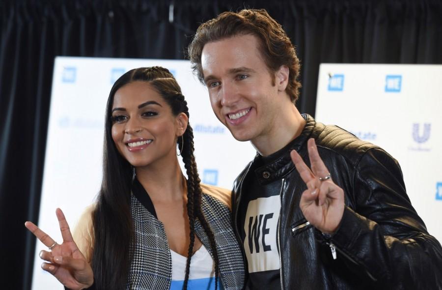Lilly Singh (L) and Craig Kielburger pose for photographers. WE Day,WE Day in Los Angeles,Celebrities celebrate WE Day,Alicia Keys,Selena Gomez,Alessia Cara