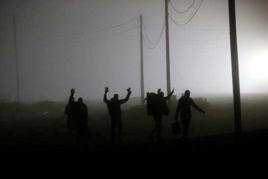 A group of migrants who said they were from Djibouti and Somalia follow railway tracks towards the Canada-U.S. border as seen from Emerson, Manitoba, Canada, March 27, 2017.