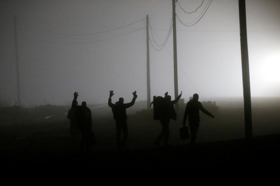 A group of migrants who said they were from Djibouti and Somalia follow railway tracks towards the Canada-U.S. border as seen from Emerson, Manitoba, Canada, March 27, 2017. Minnesota,Manitoba,Minnesota to Manitoba,asylum,Migrants,Donald Trump,Canadian border