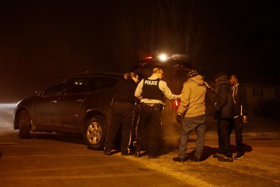 A group of migrants who said they were from Djibouti and Somalia place their belongings in a Royal Canadian Mounted Police (RCMP) vehicle after crossing the Canada-U.S. border in Emerson. Minnesota,Manitoba,Minnesota to Manitoba,asylum,Migrants,Donald Trump,Canadian border