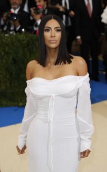 Kim Kardashian plays peasant girl in white at Met Gala 2017.