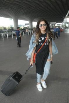 The versatile singer Kanika Kapoor is known for her style quotient. She was spotted yesterday (may 3) at the International airport in the classic ripped denim jeans with a jacket look, signature white sneakers and a steal worthy black tee.