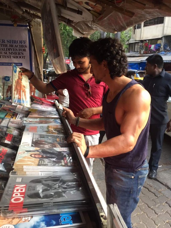The young actor exchanged pleasantries and greeted the vendor and even posed for a picture. The street of Bandra also witnessed a brief fan frenzy on spotting the action star on the street. Tiger Shroff,actor Tiger Shroff,Tiger Shroff at local magazine stall