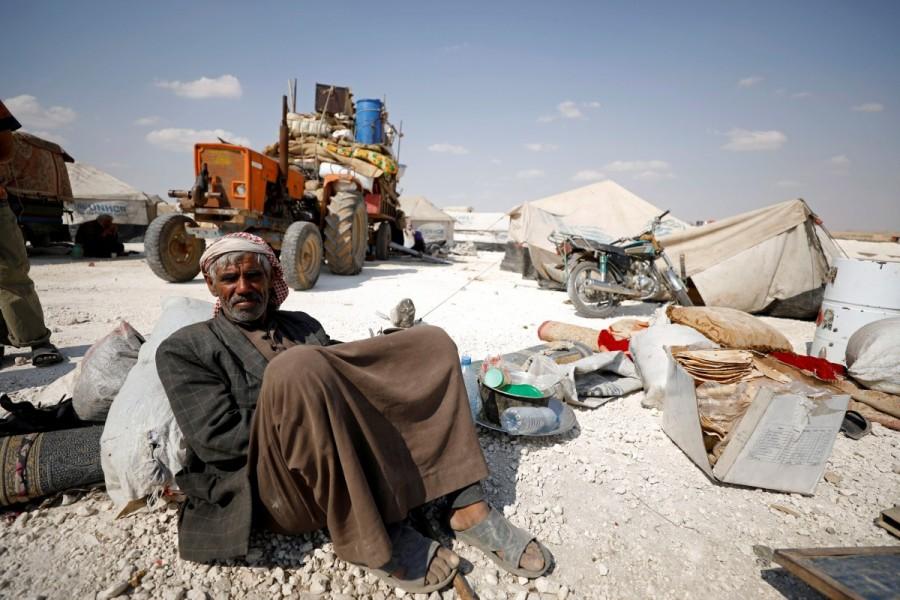 An internally displaced man who fled Raqqa city sits inside a camp in Ain Issa, Raqqa Governorate, Syria May 4, 2017. Raqqa assault,Residents flee Islamic State,Islamic State,Raqqa,Syrian Democratic Forces