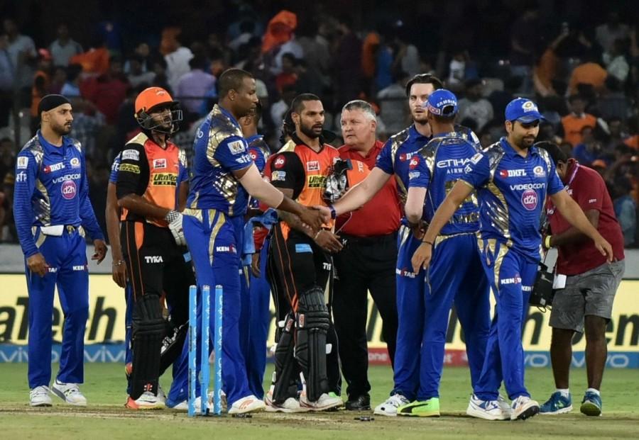 Defending champions Sunrisers Hyderabad strengthened their hold on the fourth and final play-offs spot of the Indian Premier League (IPL) as they thumped top-placed Mumbai Indians by seven wickets at the Rajiv Gandhi International Stadium here on Monday. Playing their final home game of the league stage, Hyderabad restricted Mumbai to 138/7 in 20 overs, before Shikhar Dhawan (62 not out off 46 deliveries) and Moises Henriques (44 off 35) shared a 91-run stand for the second wicket to steer them home with 1.4 overs to spare. Following this win, Hyderabad, having 15 points from 13 games, eliminated Delhi Daredevils (eight points from 11 games) from the race to the play-offs. But Hyderabad's place in the knock-outs are not confirmed, as fifth-placed Kings XI Punjab (10 points from 11 matches) can still qualify for the play-offs. Only Mumbai have sealed their berth in the play-offs, while Kolkata Knight Riders (16 points from 12 matches) and Rising Pune Supergiant (16 points from 12 matches) are strong contenders. Sunrisers Hyderabad crush Mumbai Indians,Sunrisers Hyderabad beats Mumbai Indians,Sunrisers Hyderabad,Mumbai Indians,Indian Premier League,Indian Premier League 2017,IPL,IPL 2017