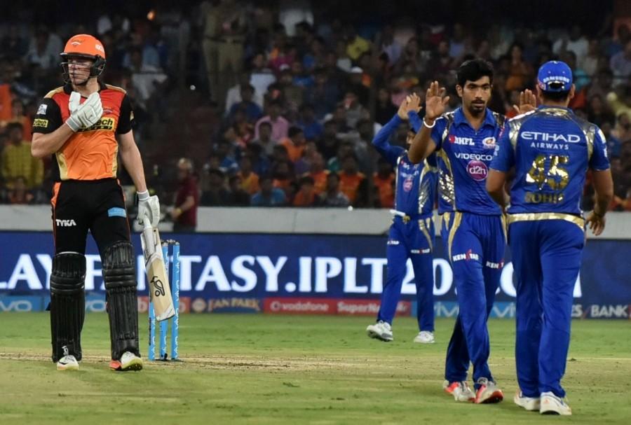 In the next over, Pandya lost his wicket, top-edging Rashid to Enriques at cover in the second ball, as Hyderabad lost their fourth wicket for 96. Rohit then completed his fifty and further threatened the hosts with a four and a six against Mohammed Siraj and Bhuvneshwar respectively. His innings ended when he played a Kaul delivery on to his stumps in the first delivery of the 19th over. The edition's leading wicket-taker Bhuvneshwar then did the job for Hyderabad by removing Kieran Pollard (5) and Karn Sharma (5) as Mumbai were restricted to 138/7. Chasing the small target, Hyderabad suffered an early nightmare as captain and leasing run-scorer Warner (6) was plumbed in front of the wickets against left-arm pacer Mitchell McClenaghan in the first ball of the second over. Then Henriques joined hands with Dhawan and the pair kept patience and played riskfree cricket after initial few quiet overs. By the end of Powerplay overs (6), they took Hyderabad to 43/1. Sunrisers Hyderabad crush Mumbai Indians,Sunrisers Hyderabad beats Mumbai Indians,Sunrisers Hyderabad,Mumbai Indians,Indian Premier League,Indian Premier League 2017,IPL,IPL 2017