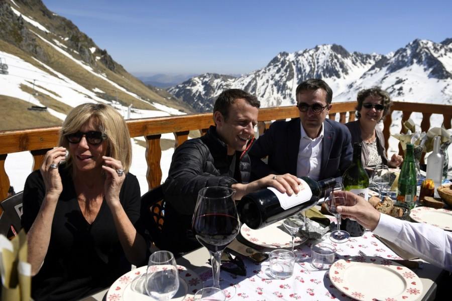 Emmanuel Macron and his wife Brigitte Trogneux have a lunch break at the mountain top during a campaign visit in Bagneres de Bigorre, in the Pyrenees mountain, France. Emmanuel Macron,Meet France's new First Lady,France First Lady,French President-elect Emmanuel Macron,Emmanuel Macron wife