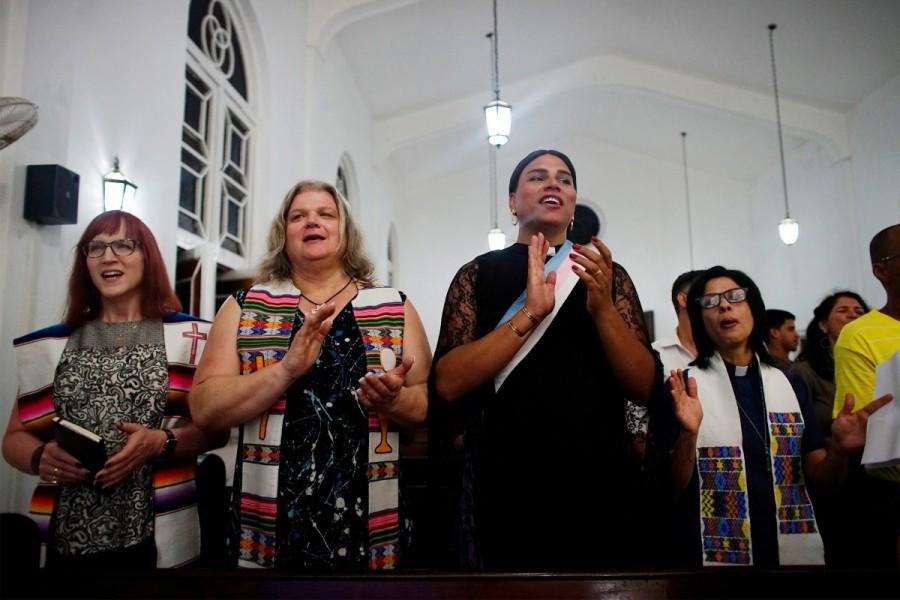 Trans Baptist reverend Allyson Robinson from the U.S. (L), trans pastors Cindy Bourgeois from Canada (2nd L) and Alexya Salvador from Brazil (2nd R) and lesbian pastor Elaine Saralegui sing during a mass in Matanzas, Cuba, May 5, 2017. For decades belonging to a religion and being anything but heterosexual was stigmatized in Communist-ruled, macho Cuba, making the Mass held by three transgender pastors in the western Cuban city of Matanzas all the more groundbreaking. Transgender,transgender Mass,Cuba hosts first transgender Mass,transgender pastors