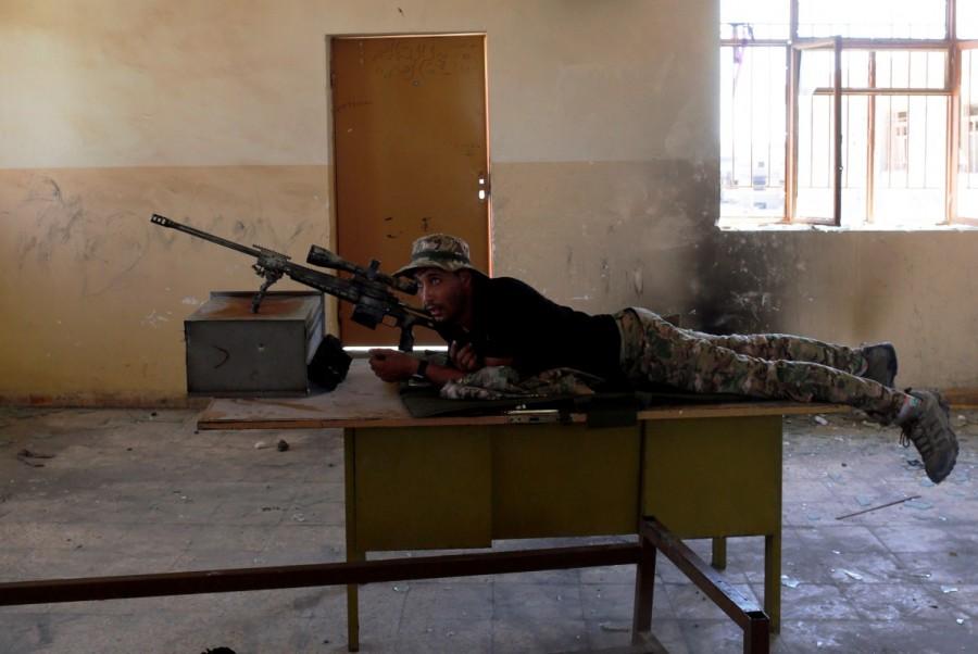 A sniper from Iraqi Army aims at Islamic State positions from a school building on the frontline during clashes in north west of Mosul, Iraq, May 8, 2017. Iraqi forces,west Mosul,northwest Mosul
