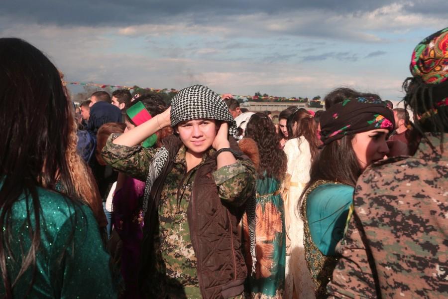 A Kurdish fighter from the People's Protection Units (YPG) takes part during a celebration for the spring festival of Nowruz, in the northeastern Syrian city of Qamishli near the Turkish border, Syria March 21, 2017. Kurdish YPG fighter,Syria,NATO ally Turkey,NATO,Turkey,Kurdish YPG fighters,Syrian city,Raqqa,Islamic State