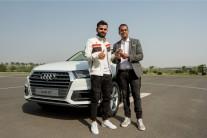 Audi, the German luxury car manufacturer, today, welcomed the Captain of the Indian national cricket team Virat Kohli into the Audi Q family by adding another ‘quattro’ muscle into his fleet; Mr. Rahil Ansari, Head, Audi India handed over the keys of the SUV icon Audi Q7 45 TDI in Carerra White colour to the National Cricket icon Virat Kohli.