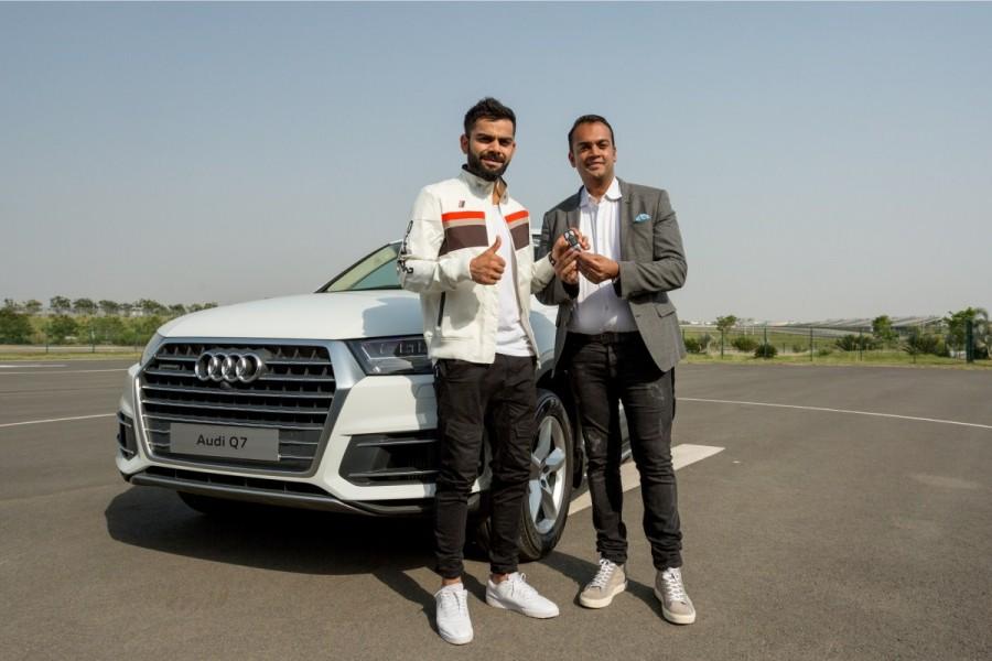 Audi, the German luxury car manufacturer, today, welcomed the Captain of the Indian national cricket team Virat Kohli into the Audi Q family by adding another ‘quattro’ muscle into his fleet; Mr. Rahil Ansari, Head, Audi India handed over the keys of the SUV icon Audi Q7 45 TDI in Carerra White colour to the National Cricket icon Virat Kohli. Virat Kohli,Audi Q7,Virat Kohli into the Audi Q family,Virat Kohli,Audi India,Virat Kohli Audi,Audi Virat Kohli,Virat Kohli Audi Q7,Audi Q7 Virat Kohli