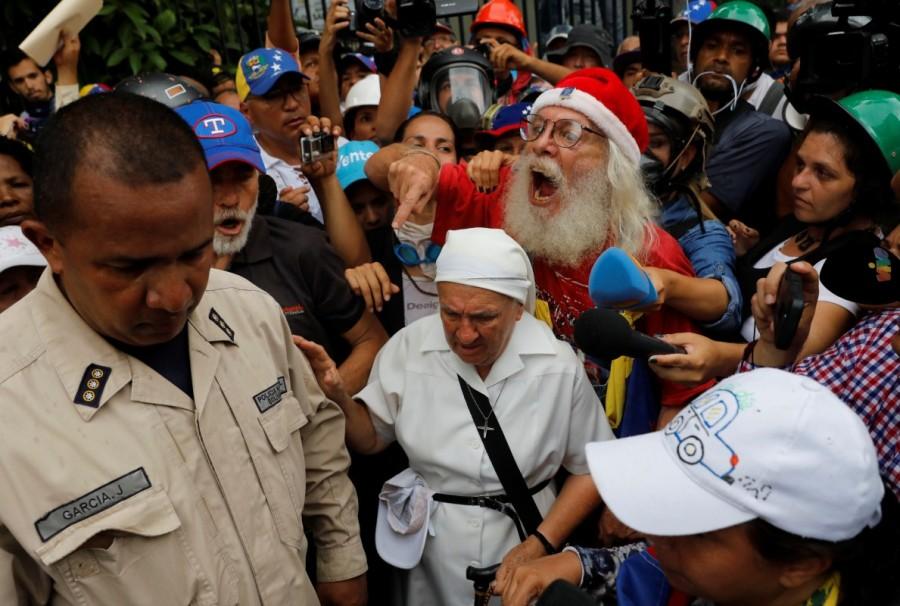 Elderly opposition supporters confront security forces while rallying against President Nicolas Maduro in Caracas, Venezuela. Elderly Venezuelan,Elderly Venezuelan protesters,President Nicolas Maduro,Venezuelan President Nicolas Maduro,Nicolas Maduro