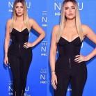 Khloe and Kim Kardashian pose together in plunging outfits.