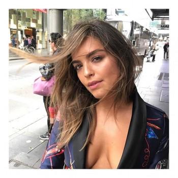 Olympia Valance flaunts her cleavage.