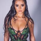 Demi Rose flaunts her ample cleavage.
