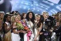 A 25-year-old scientist representing the District of Columbia is crowned winner of the Miss USA pageant.