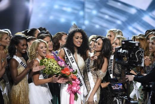 A 25-year-old scientist representing the District of Columbia is crowned winner of the Miss USA pageant.