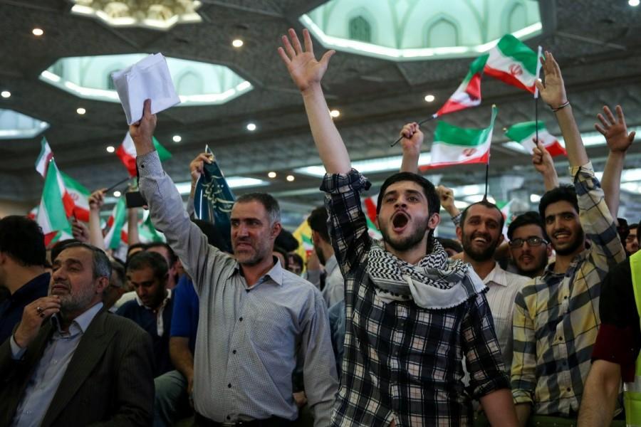 Supporters of Iranian presidential candidate Ebrahim Raisi chant slogans during a campaign meeting at the Mosalla mosque in Tehran, Iran, May 16, 2017. Under Iran's system, the powers of the elected president are circumscribed by those of the conservative supreme leader, Ayatollah Ali Khamenei, who has been in power since 1989. All candidates must be vetted by a hardline body. Nevertheless, elections are fiercely contested and can bring about change within the system of rule overseen by Shi'ite Muslim clerics. Iran,Iran presidential election,presidential election,Hardline cleric Ebrahim Raisi,President Hassan Rouhani,Hassan Rouhani