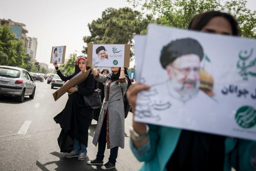 Supporters of Iranian presidential candidate Ebrahim Raisi chant slogans during a campaign meeting at the Mosalla mosque in Tehran, Iran, May 16, 2017. Under Iran's system, the powers of the elected president are circumscribed by those of the conservative supreme leader, Ayatollah Ali Khamenei, who has been in power since 1989. All candidates must be vetted by a hardline body. Nevertheless, elections are fiercely contested and can bring about change within the system of rule overseen by Shi'ite Muslim clerics. Iran,Iran presidential election,presidential election,Hardline cleric Ebrahim Raisi,President Hassan Rouhani,Hassan Rouhani