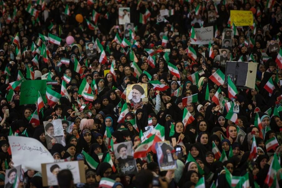 Supporters of Iranian presidential candidate Ebrahim Raisi chant slogans during a campaign meeting at the Mosalla mosque in Tehran, Iran, May 16, 2017. Under Iran's system, the powers of the elected president are circumscribed by those of the conservative supreme leader, Ayatollah Ali Khamenei, who has been in power since 1989. All candidates must be vetted by a hardline body. Nevertheless, elections are fiercely contested and can bring about change within the system of rule overseen by Shi'ite Muslim clerics. Iran,Iran presidential election,presidential election,Hardline cleric Ebrahim Raisi,President Hassan Rouhani,Hassan Rouhani