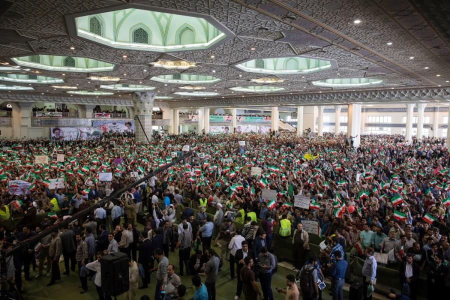 Supporters of Iranian presidential candidate Ebrahim Raisi chant slogans during a campaign meeting at the Mosalla mosque in Tehran, Iran, May 16, 2017. Under Iran's system, the powers of the elected president are circumscribed by those of the conservative supreme leader, Ayatollah Ali Khamenei, who has been in power since 1989. All candidates must be vetted by a hardline body. Nevertheless, elections are fiercely contested and can bring about change within the system of rule overseen by Shi'ite Muslim clerics. Iran,Iran presidential election,presidential election,Hardline cleric Ebrahim Raisi,President Hassan Rouhani,Hassan Rouhani