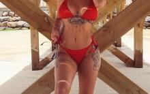 Love Island's Olivia Buckland flaunts her curves in red bikini.