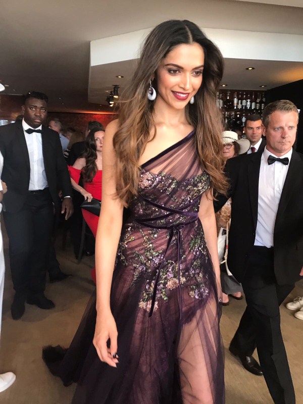 Bollywood actress Deepika Padukone let her hair loose - literally - as she stepped out in a jewel-toned maroon creation by Marchesa Notte for her red carpet appearance at the opening ceremony of the Cannes Film Festival here on Wednesday. She walked before the screening of French director Arnaud Desplechin's "Les Fantomes d'Ismael". Actress Deepika Padukone,Deepika Padukone,Deepika Padukone at Cannes Film Festival,Deepika Padukone at Cannes,Marchesa Notte,Cannes Film Festival,Cannes Film Festival 2017,Deepika Padukone hot pics,Deepika Padukone hot images,Deepika Padukone hot stills,D