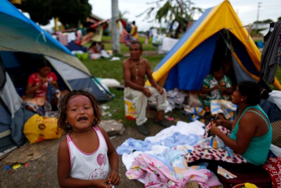 A child from the indigenous Warao people from the Orinoco Delta in eastern Venezuela, is seen near a bus terminal in Manaus, Brazil. Venezuela,indigenous flee crisis,flee crisis,Caribbean coast,Manaus,Amazonian metropolis