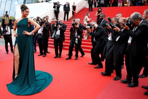 Indian actress Deepika Padukone's second red carpet appearance at the Cannes Film Festival here saw her make a bold statement with smoky eyes in antique green, matched with a bottle green gown which had a thigh-high slit to add the oomph.