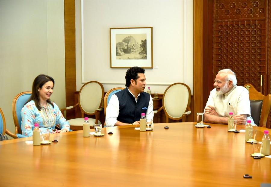"Briefed our honourable PM Narendra Modi about the film 'Sachin: A Billion Dreams' and received his blessings," Sachin captioned the image. "Sachin: A Billion Dreams", directed by James Erskine, is about Tendulkar's personal journey from a young boy to a cricketing icon. Sachin: A Billion Dreams,Sachin: A Billion Dreams Release,Sachin: A Billion Dreams movie Release,Sachin Tendulkar receives Narendra Modi blessings,Sachin Tendulkar meets Narendra Modi,Narendra Modi,PM Narendra Modi,Modi,Sachin Tendulkar
