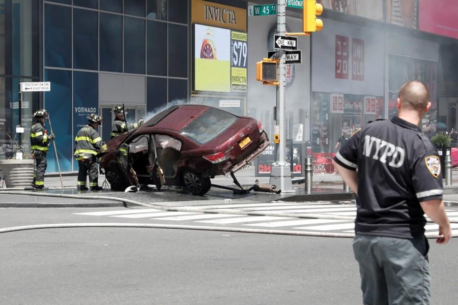 A vehicle that struck pedestrians and later crashed is seen on the sidewalk in Times Square in New York City, May 18, 2017. Car rams Times Square pedestrians,car crashed,New York City,Times Square