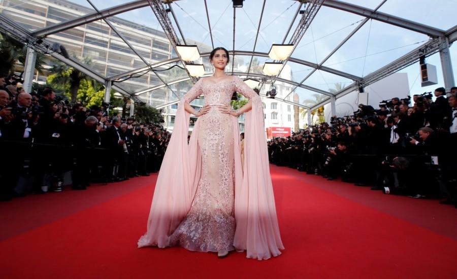 Bollywood actress Sonam Kapoor sported a Cher-inspired psychedelic look for her appearance at the Cannes Film Festival here on the occasion of the singing sensation's birthday. The "Believe" hitmaker, known for bold fashion choices, turned 71 on Saturday. And Sonam, who is here to walk the red carpet of the 70th Cannes Film Festival as the ambassador of the global cosmetic brand L'Oréal Paris on Sunday and May 22, took to Instagram to wish the star in a series of posts. Cannes 2017,Fashion queen Sonam Kapoor,Sonam Kapoor,Sonam Kapoor at Cannes 2017,Sonam Kapoor at Cannes,Sonam kapoor at Cannes film festival,actress Sonam Kapoor,Sonam Kapoor new pics,Sonam Kapoor new images,Sonam Kapoor new stills,Sonam Kapoor new picture