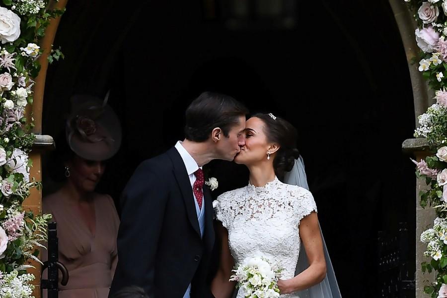Pippa Middleton kisses her new husband James Matthews, following their wedding ceremony at St Mark's Church in Englefield, west of London. Pippa Middleton marries James Matthews,Pippa Middleton,James Matthews,Pippa Middleton weds James Matthews,Pippa Middleton and James Matthews,Pippa Middleton and James Matthews marriage pics,Pippa Middleton and James Matthews marriage images,Pippa Middle