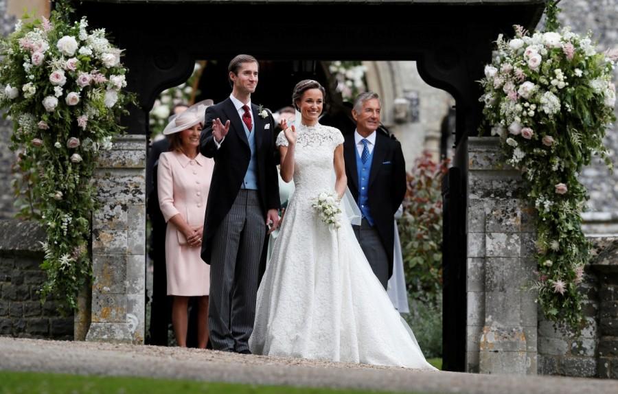 Pippa Middleton and James Matthews pose for photographs after their wedding at St Mark's Church in Englefield. Pippa Middleton marries James Matthews,Pippa Middleton,James Matthews,Pippa Middleton weds James Matthews,Pippa Middleton and James Matthews,Pippa Middleton and James Matthews marriage pics,Pippa Middleton and James Matthews marriage images,Pippa Middle